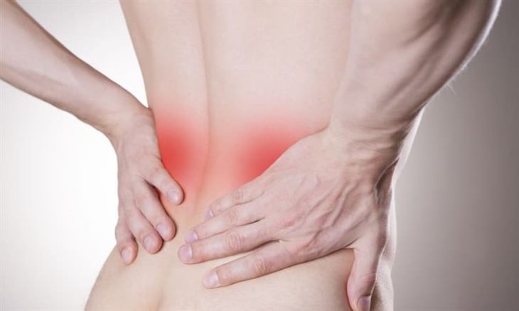 Bị mỏi lưng do thoái hóa cột sống thắt lưng nên điều trị như thế nào?